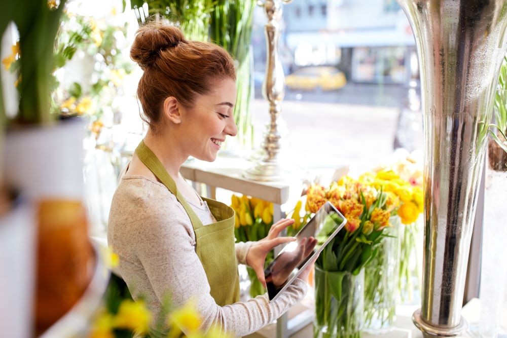A photo of Flower Shop Owner doing the books